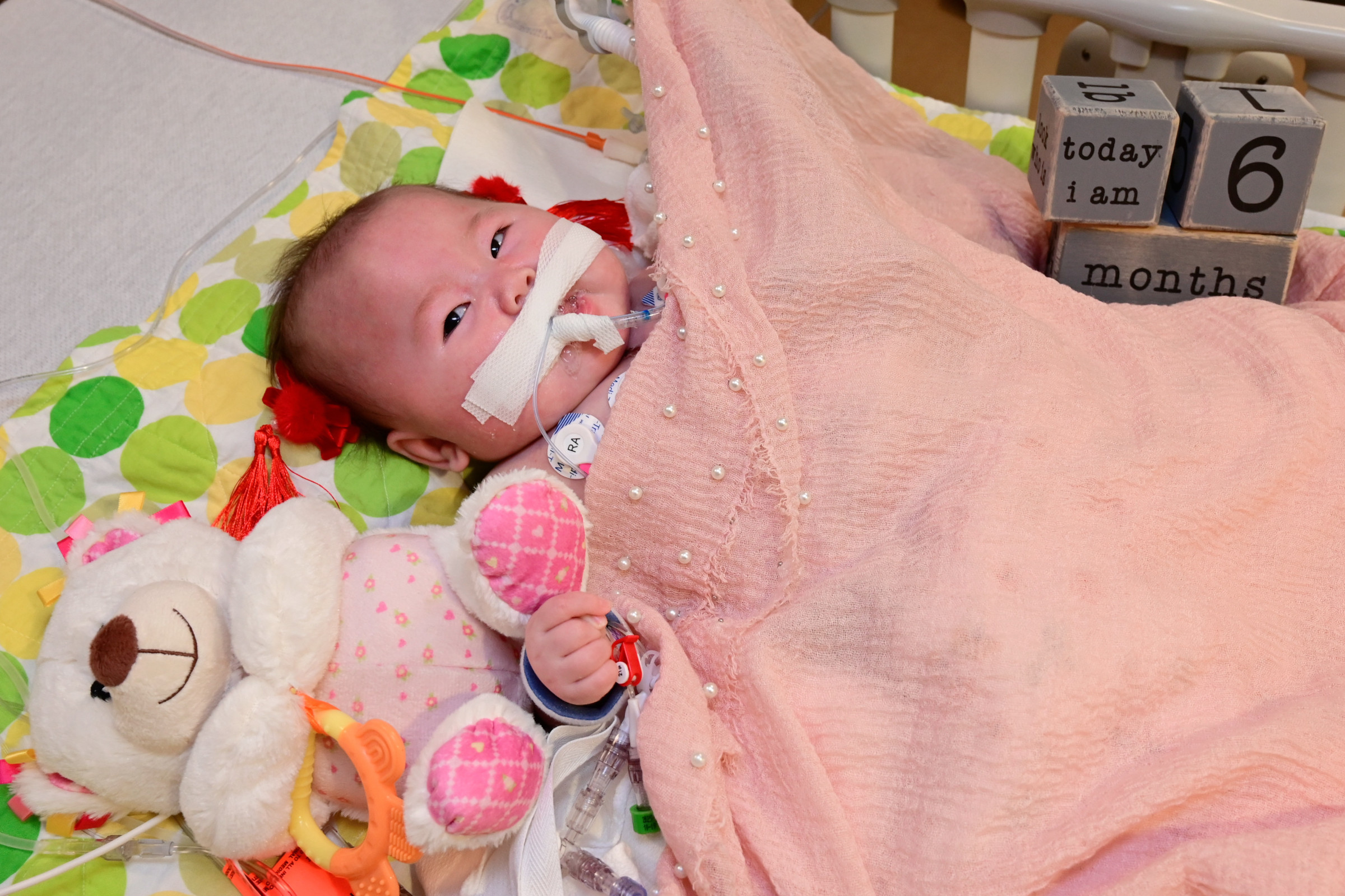 Image of Constance with blocks written 'today I am 6 months'