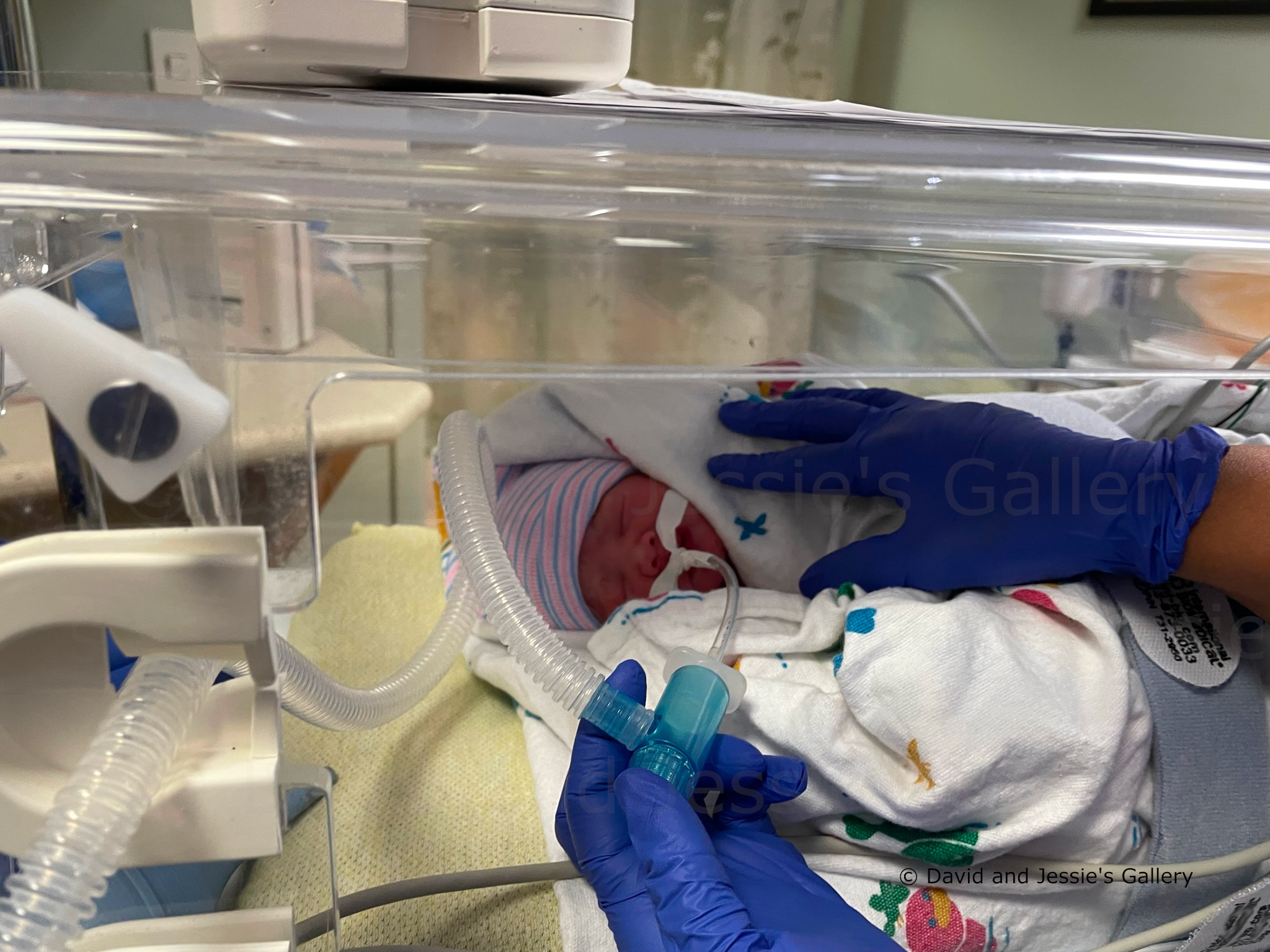 Image with nurses tending to a newborn.